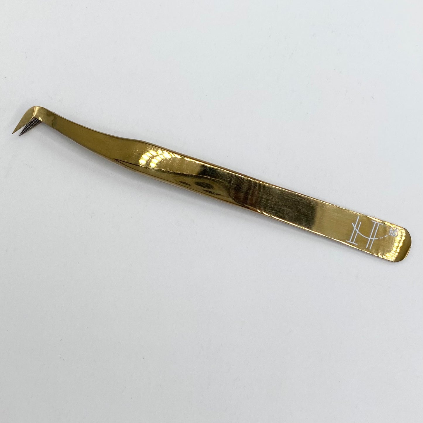 Gold booted tweezer- fiber tip