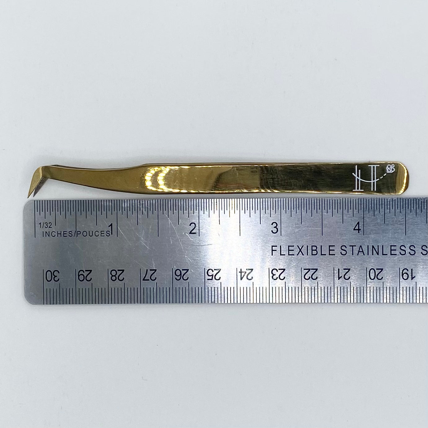 Gold booted tweezer- fiber tip