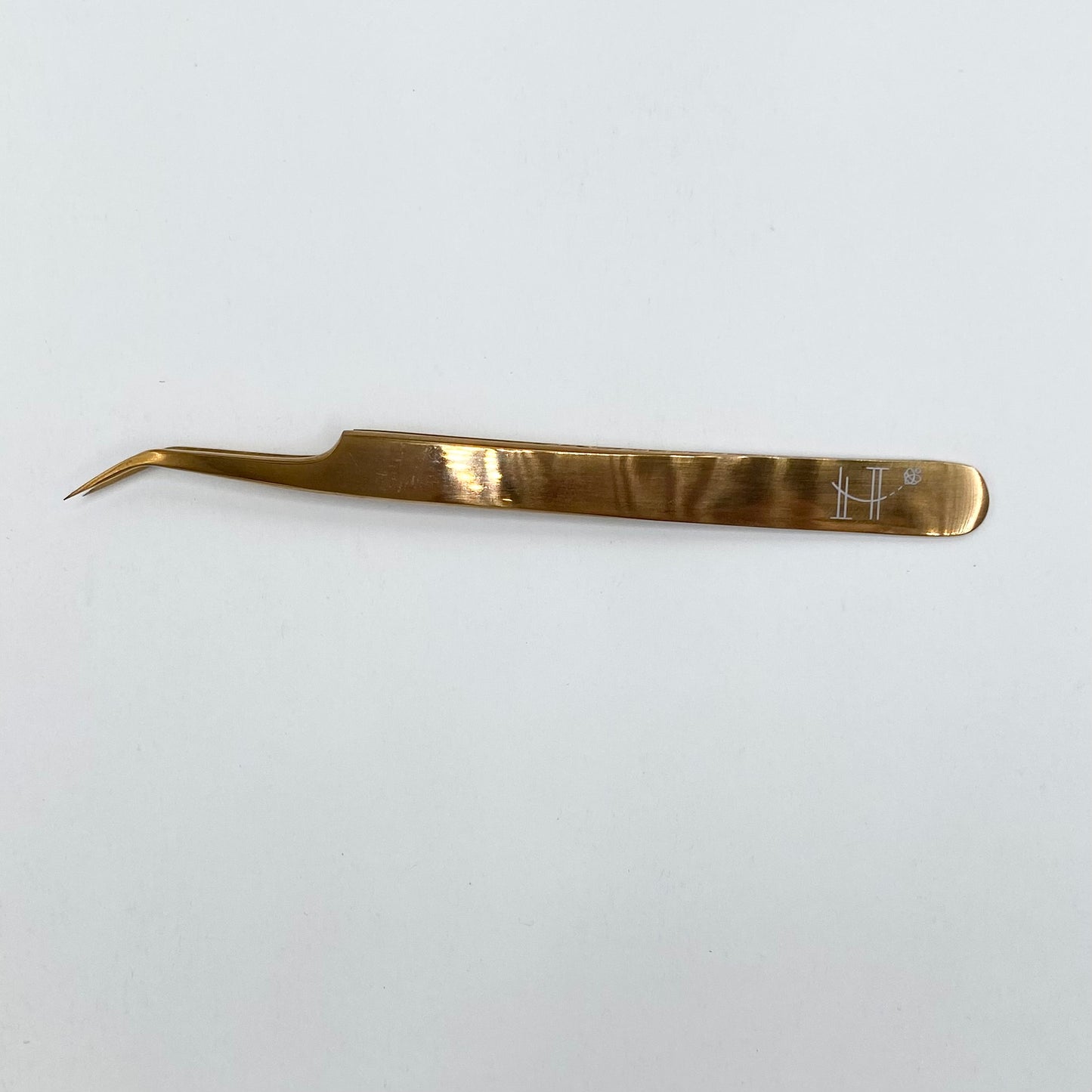 Elongated angled tweezer