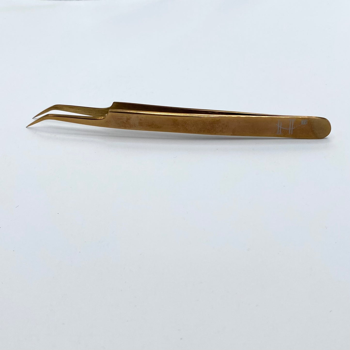 Elongated angled tweezer