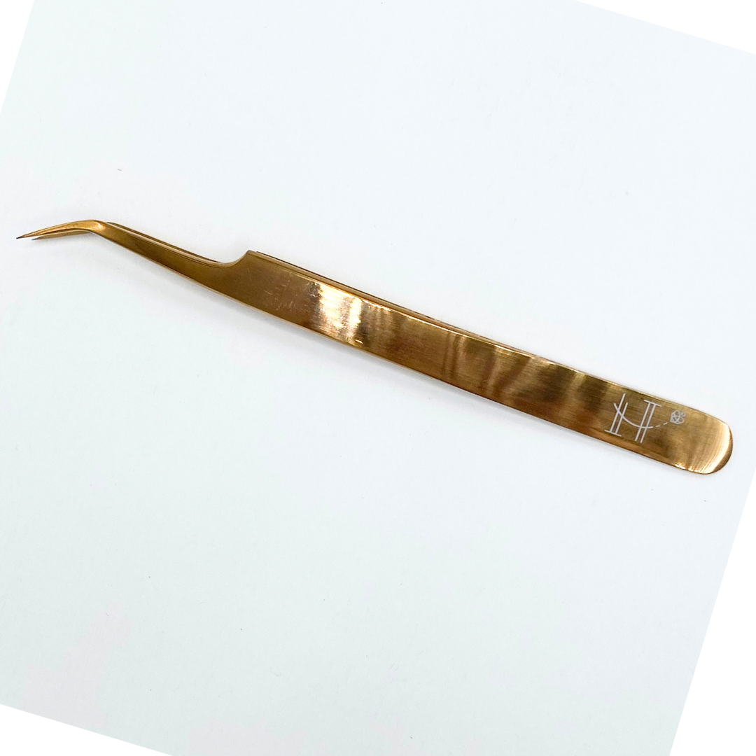 Elongated angled tweezer