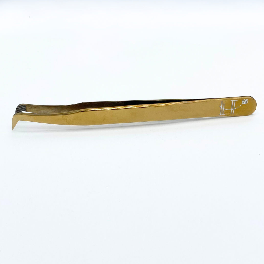 Gold booted tweezer- fiber tip